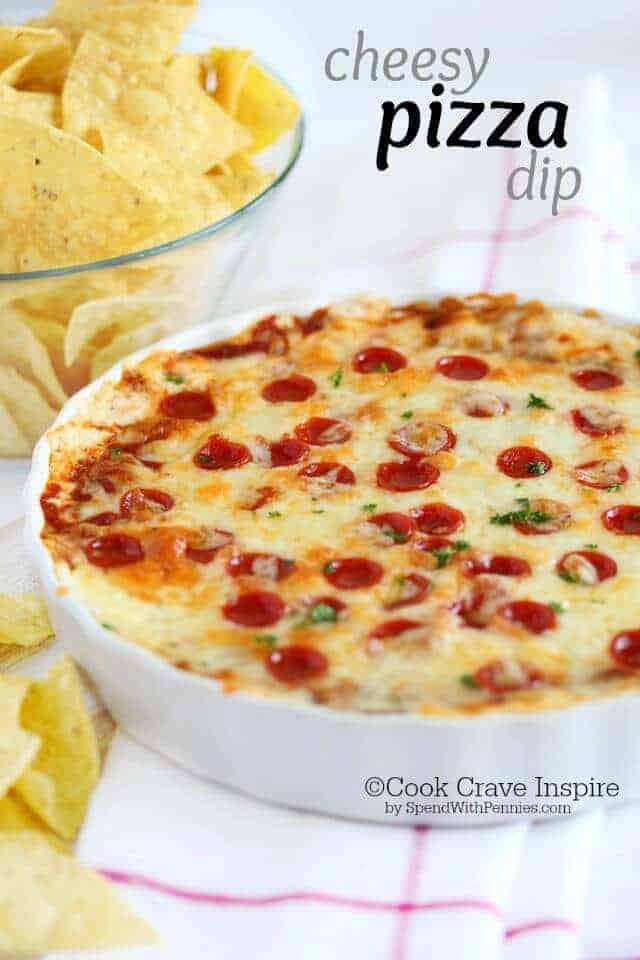 Easy Cheesy Pizza Dip recipe. A delicious creamy cheesy pizza dip loaded with sauce & your favorite toppings, hot from the oven! A big hit at every party!
