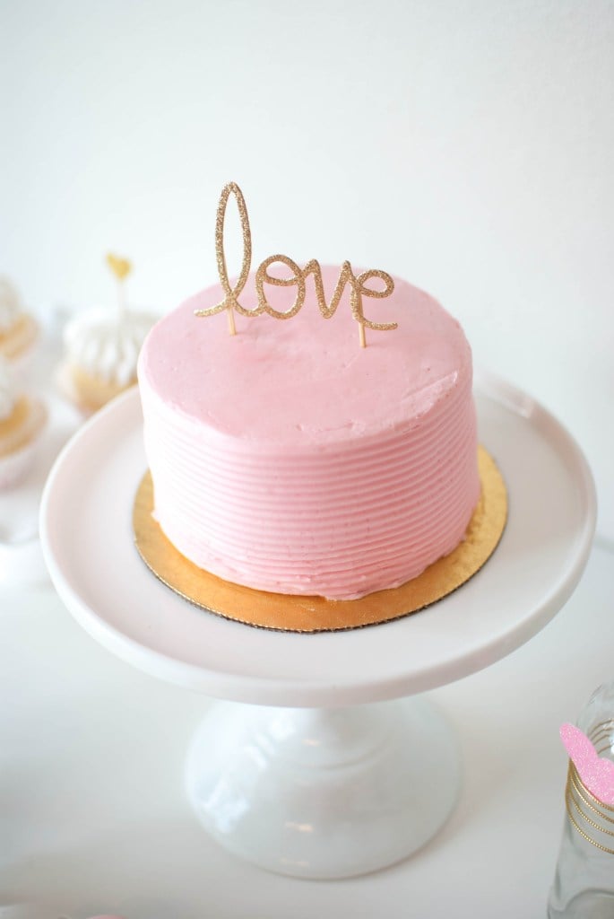 Gold glitter LOVE on pink cake