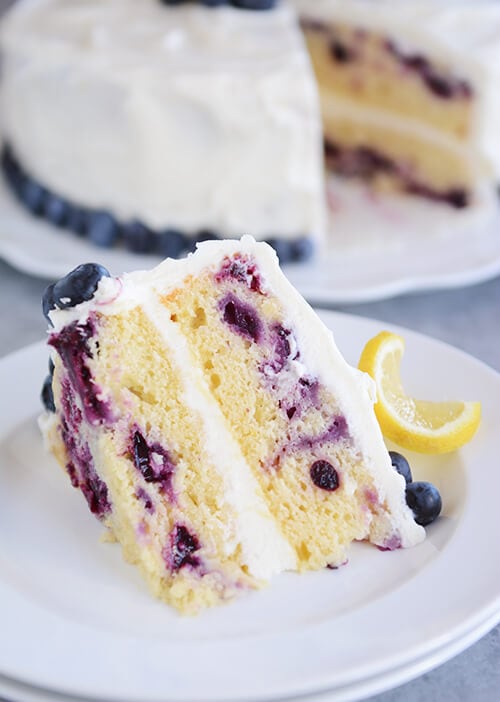 Lemon Blueberry Cake with Whipped Lemon Cream Frosting + 50 Delicious Berry Recipes... refreshingly sweet treats that you can enjoy all summer long!