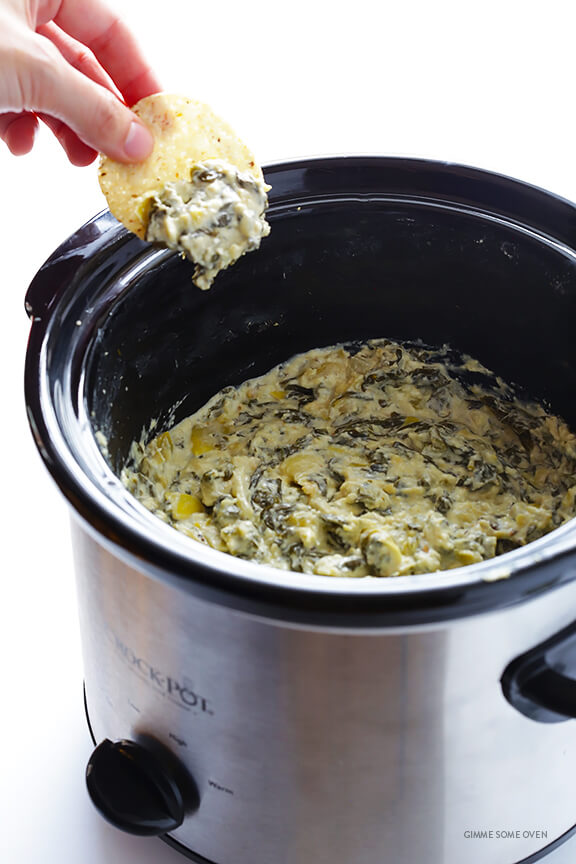 Slow Cooker Spinach Artichoke Dip -- the delicious dip we all love, made extra quick and easy in the crock pot | gimmesomeoven.com