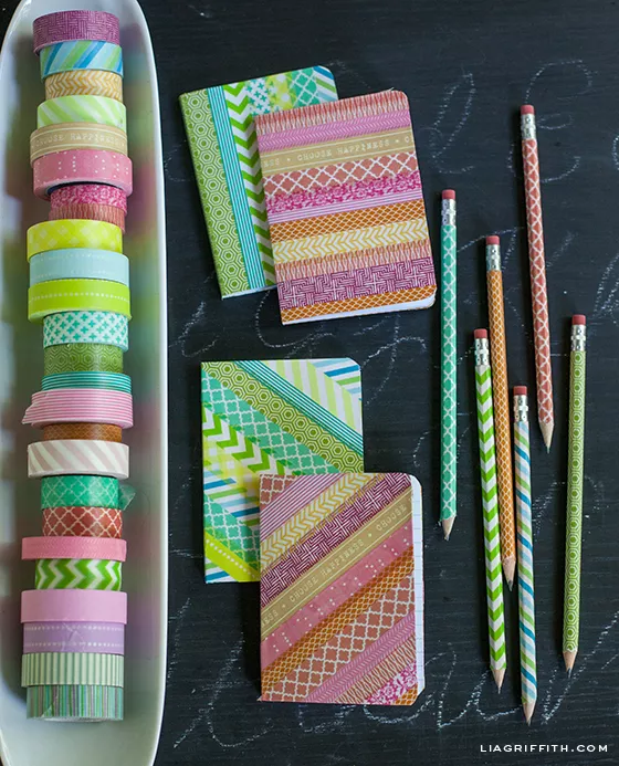 notebooks and pencils decorated with washi tape