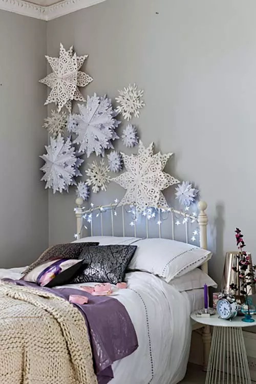 paper snowflakes on a bedroom wall