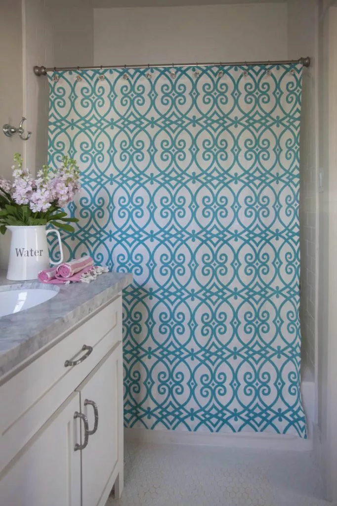 diy shower curtain with teal swirl pattern and grommets