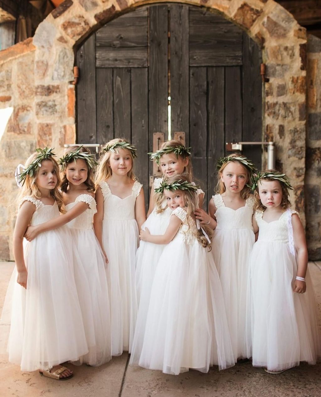 lace flower girl dress with tulle skirt and greenery halos