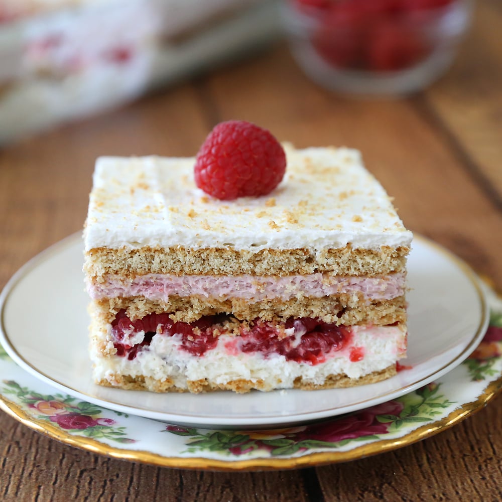 Raspberry Cheesecake Icebox Cake is your new favorite summer dessert! This easy no bake dessert features fresh raspberries and a delicious cheesecake filling.