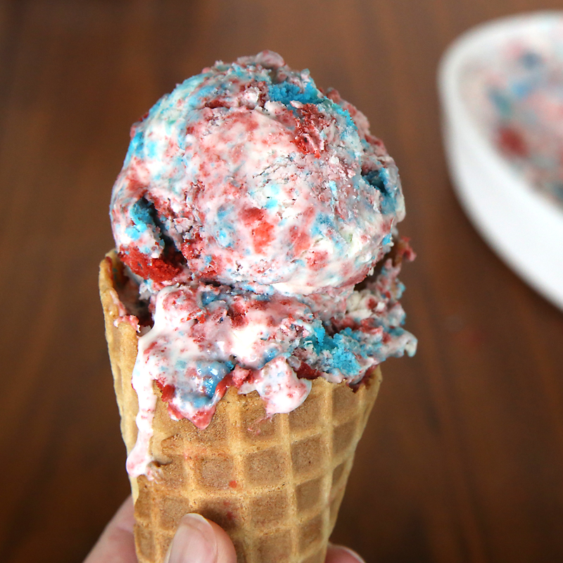 Red, white, and blue no churn cake ice cream! This is super easy to make, doesn't require an ice cream machine, and is perfect for the Fourth of July! Easy 4th of July dessert recipe.
