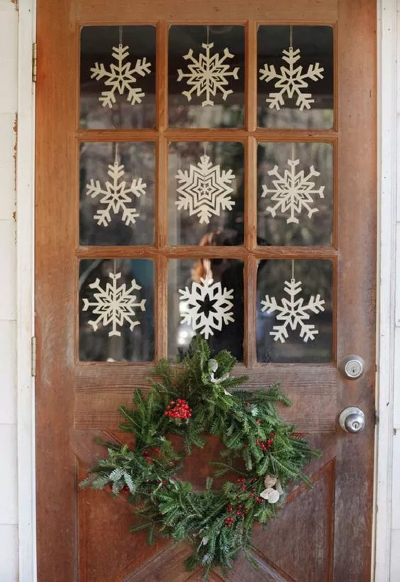 paper snowflakes decorating a door