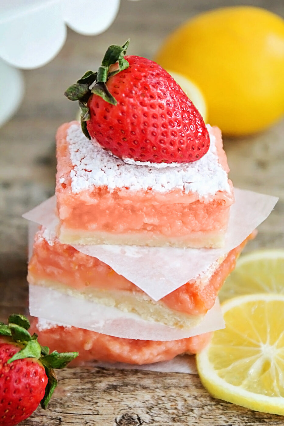 These strawberry lemonade bars are tangy and sweet and perfect for summer. They taste just like a glass of strawberry lemonade!