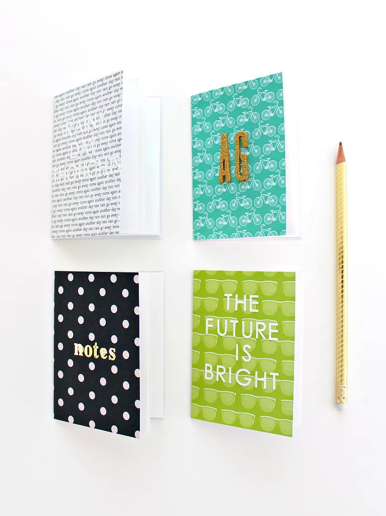 four decorated notebooks