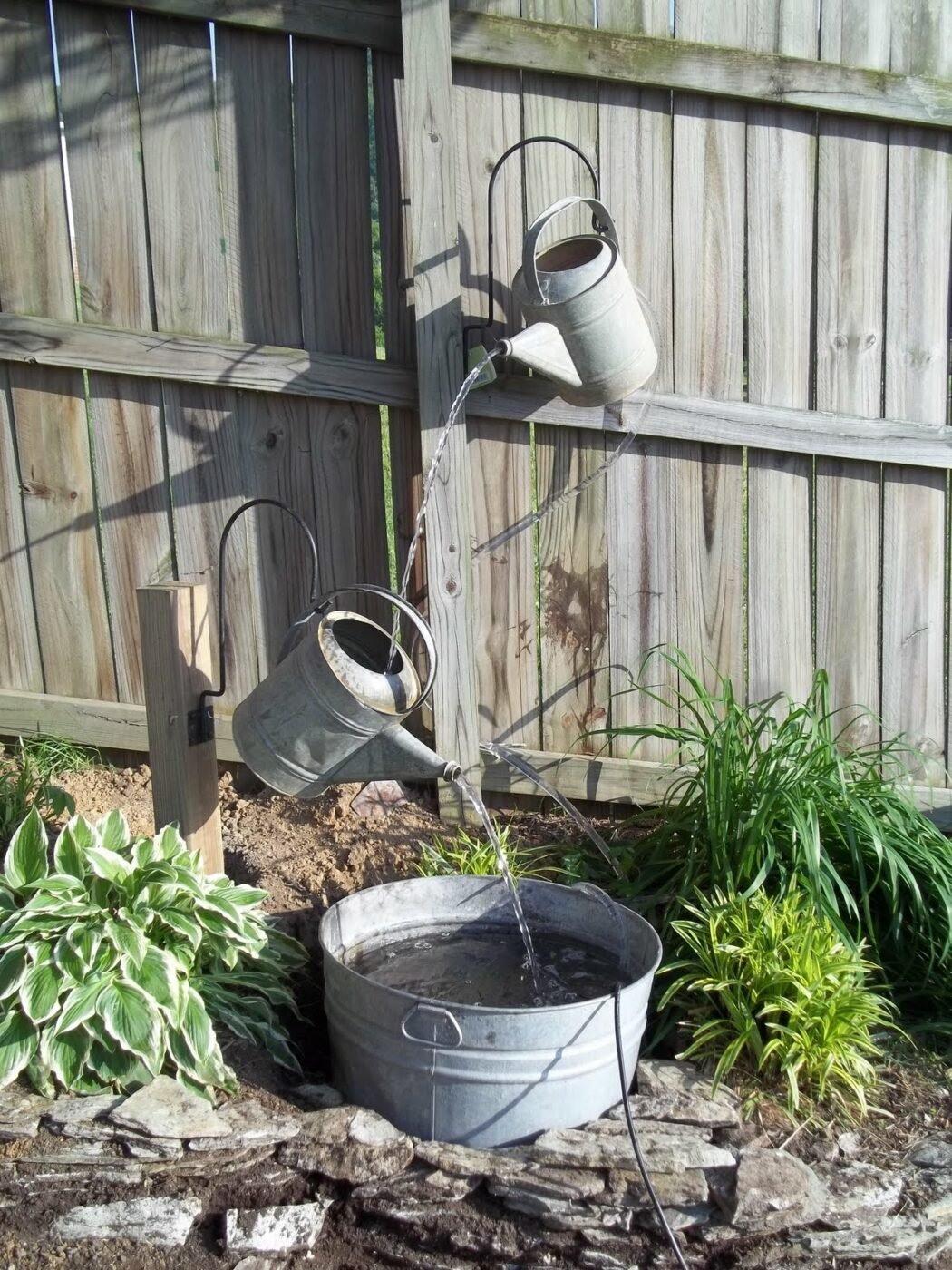 40+ Creative DIY Water Features For Your Garden --> DIY Water Jug Water Feature