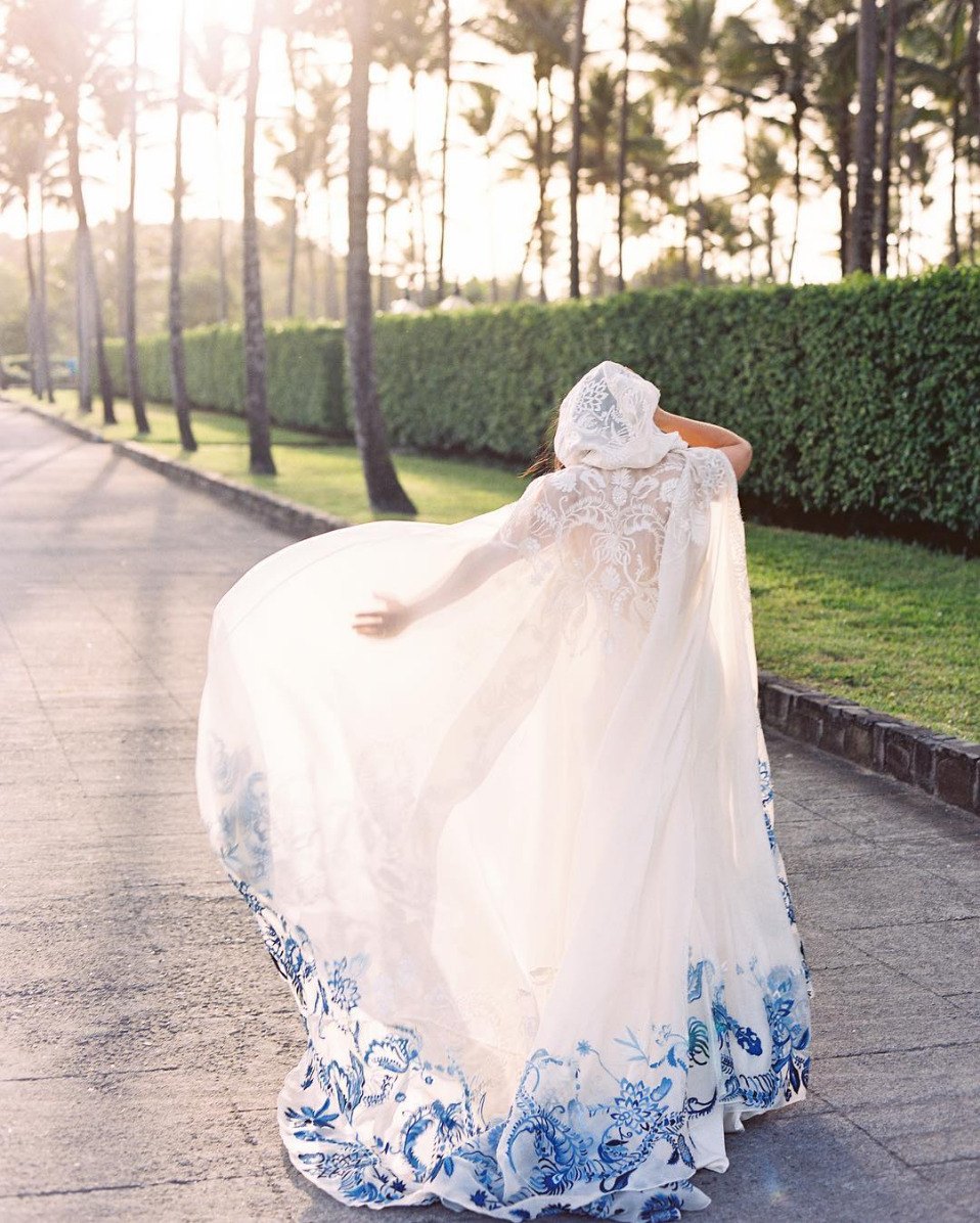 fine art wedding romantic flowy bridal cape with blue designs on hem